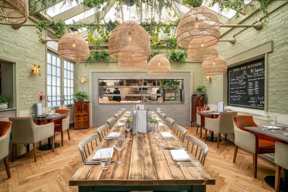 modern pub dining surrey 1 Contemporary restaurant design - large group table with kitchen view