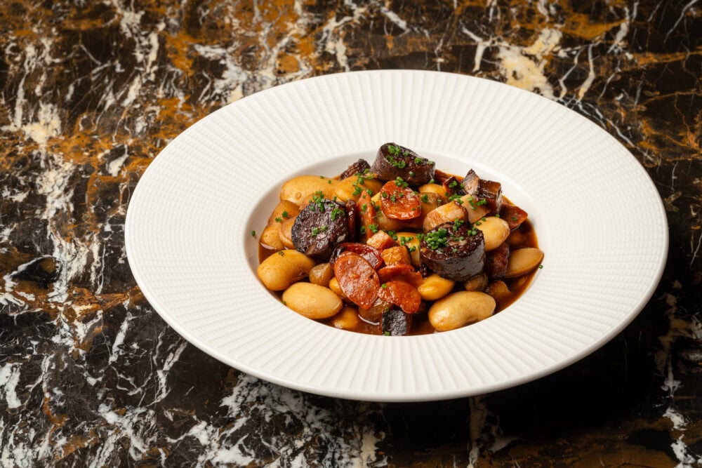 restaurant_food_photography (3) Spanish food in a white bowl in a high end Spanish restaurant in the UK