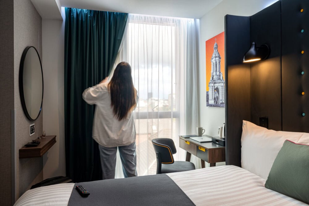 Curtains are opened in a hotel room